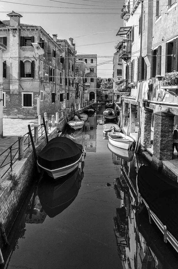 Long exposure color and black & white photograph of Venice, Italy’s canals and architecture during the day and night