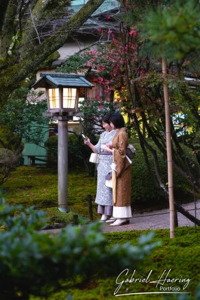 Autumn foliage in Kenrokuen Garden with maple trees in yellow, orange, and red
